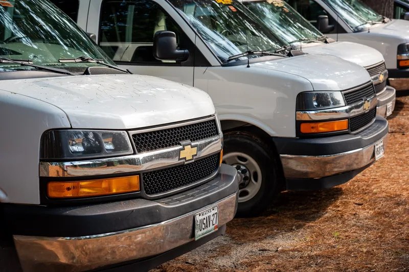 Tripping at Camp Wigwam — Rarely are all these vehicles at camp as we're always on outings to the mountains, Portland Sea Dogs, blueberry picking, gem mining, and much more!