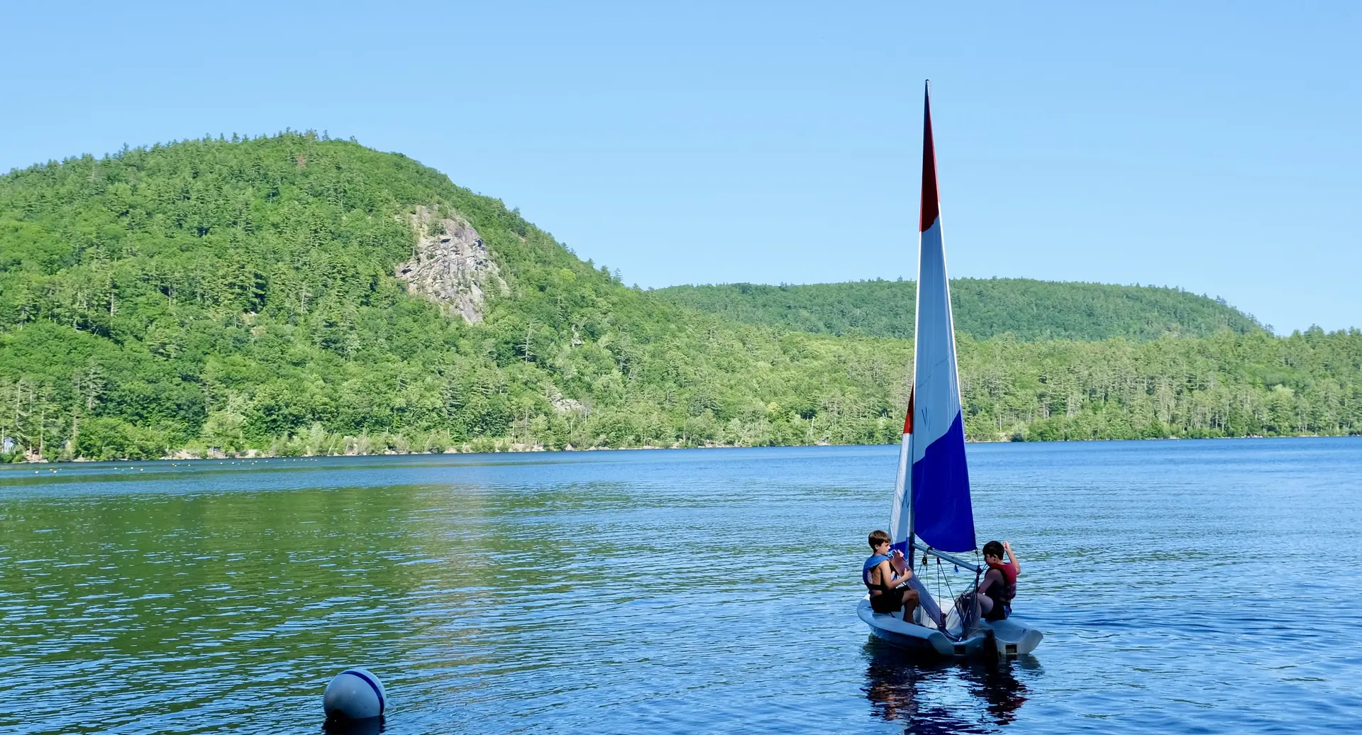 Prospective Camp Wigwam families touring the lakeside campus